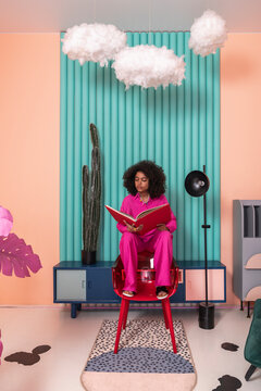Woman Reading in Stylish Modern Home Setting