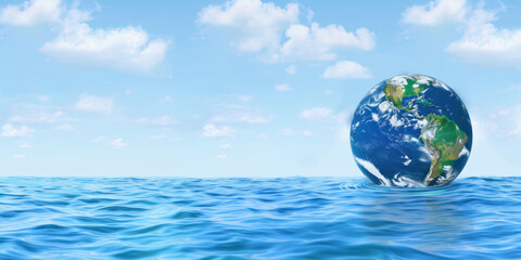 An Earth globe floating in a clean blue ocean highlighted by a clear sky, ideal for water conservation themes or digital banners for Earth Day and environmental preservation messages.