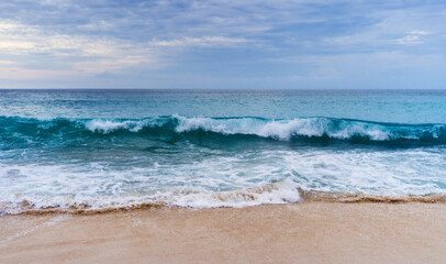 Fototapeta na wymiar Ocean waves on the beach background