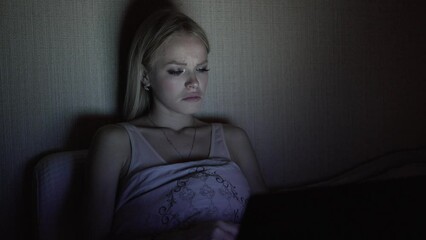 The girl is watching the finale of her favorite TV series with a sad ending.