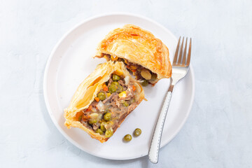 Sliced beef pot pie on plate, horizontal, top