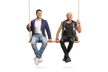 Casual man and a punk sitting together on a big wooden swing
