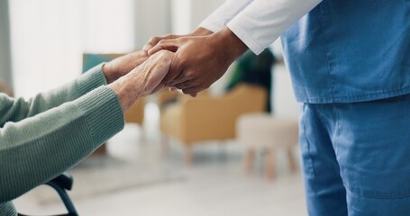 Nurse, senior patient and holding hands in closeup for support, help and recovery in retirement. Physiotherapist, care and elderly person with disability in wheelchair at clinic for rehabilitation