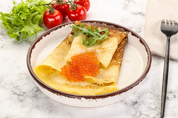 Russian pancake with red caviar