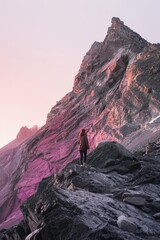 mountains landscape with a woman hiking and traveling alone,, having time  in the nature,lilac and pink purple color palette