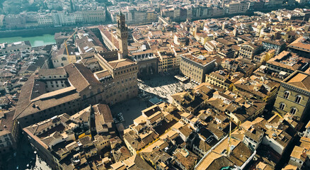 Obraz premium Aerial view of famous tower and Palazzo Vecchio square and Florence cityscape, Italy. High quality photo