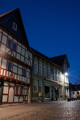 Street alley in the small town of Schwabisch Hall, with houses and buildings with typical German architecture and street lanterns, at night. - 751331690