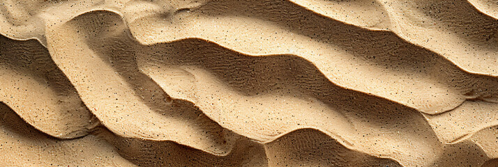 Textured sand dunes in close-up. Natural sandy background for design and print with copy space.