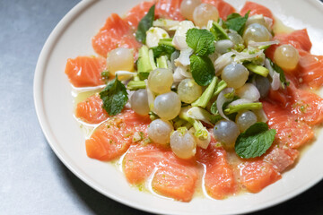 Spicy salmon salad with giant catfish roe and herbs; delicious fusion food. 