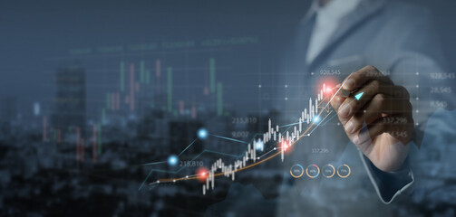 Financial analyst analyzes stock trading charts Economic growth charts, planning, ideas, business,...