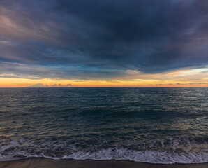 sunset over a stromy mediterranean sea