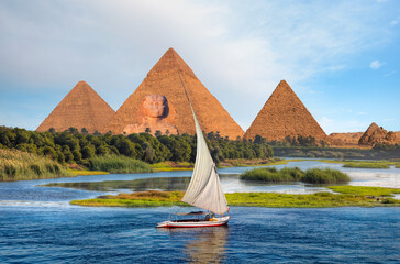 Beautiful Nile scenery with sailboat in the Nile on the way to pyramids, Egypt
