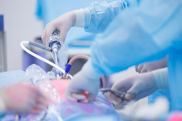 Doctor surgeon holding laparoscopic instrument in abdomen of patient. Minimally invasive surgery,...