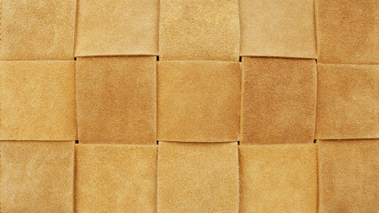 Brown suede square pattern background. Closeup vintage texture.