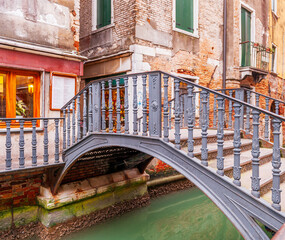 Typical canal and bridge in Venice in Veneto, Italy - 751343872