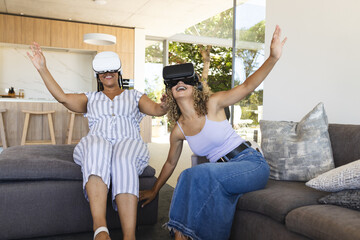 Biracial couple enjoys virtual reality games at home