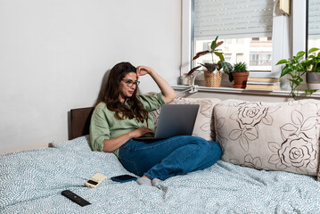 Side hustle money, second job concept. Young university student woman working freelance internet...