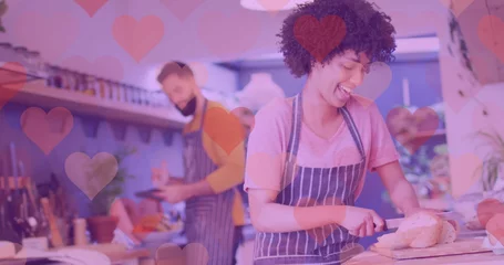 Zelfklevend Fotobehang Image of hearts over happy diverse couple preparing meal © vectorfusionart