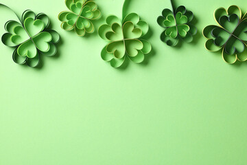 St Patricks Day banner design with four-leaf clover paper art. Flat lay, top view. Happy St....