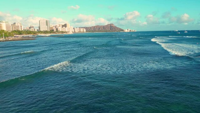Honolulu, Hawaii shoreline flyover from Ala Moana to Waikiki with Diamond Head crater in the distance.