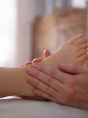 Foot Massage and Reflexology concept. Alternative medicine, Holistic approach. Soft focus image
