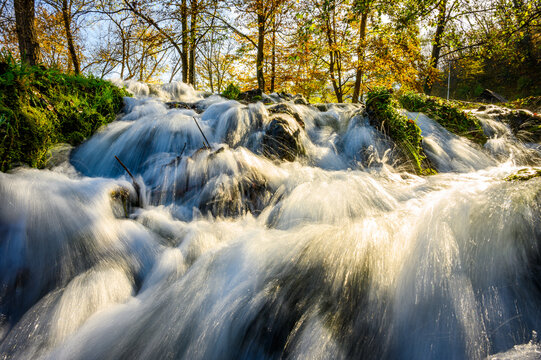 Small waterfall on famous landmark Mlincici near Jajce on Plivsko Lake in Bosnia and Herzegovina. Long exposure waterfall photo.