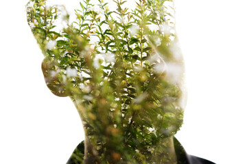 A colorful double exposure male portrait with leafy facial features - 751388618