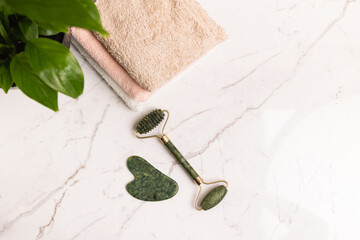Guasha scraper on the bathroom table