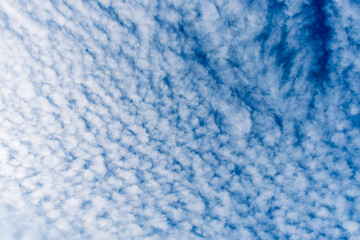 cloudy sky background for wallpaper and design, day skyscape with white beautiful clouds and blue sky