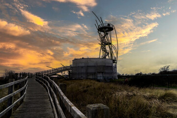 The Warandetoren during a beautiful sunset located in the Belgian coastal city of Middelkerke.  Golden hour at the flanders belgium coast with view on tower in Middelkerke.  Toerism flanders coast.