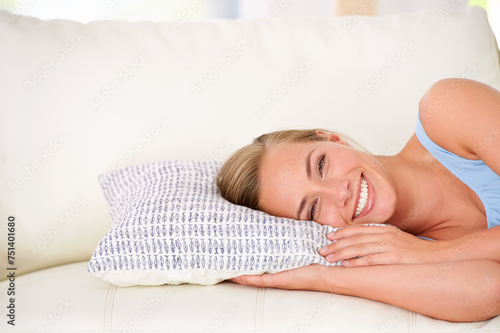 Canvas Prints Portrait, woman and happy on couch laying with pillow to relax, lounge at home in apartment. Smiling, female person resting on weekend, Sunday break in free time on holiday on comfortable vacation