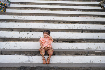 Toddler kindergarten girl wear Thai style costume travel in Wat Arun buddhist temple sightseeing travel