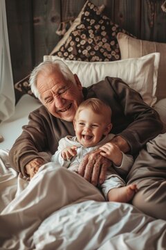 Joyful elderly man playing with a happy toddler in a cozy home setting