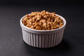 Delicious fresh peeled raw walnuts in a ceramic plate