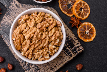 Delicious fresh peeled raw walnuts in a ceramic plate