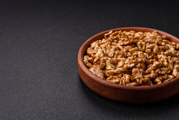 Delicious fresh peeled raw walnuts in a ceramic plate