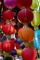 Fototapeta na wymiar Traditional Vietnamese silk lantern light covers sold at a street market in Hanoi.