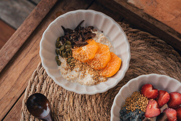 Oatmeal with chocolate orange topping and bee pollen