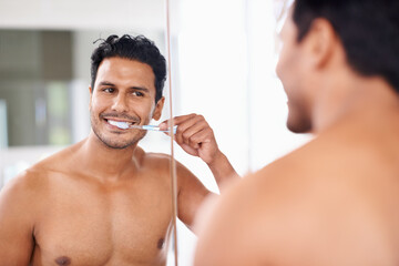 Oral hygiene, mirror and man in bathroom for brushing teeth, self care and morning routine. Dental,...