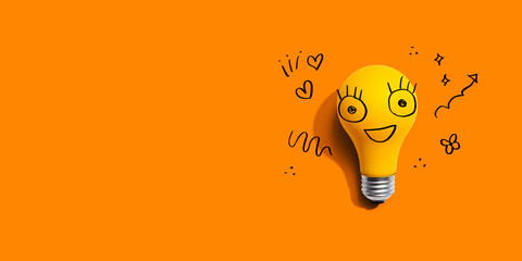 Yellow light bulb with happy face - flat lay - 751418801