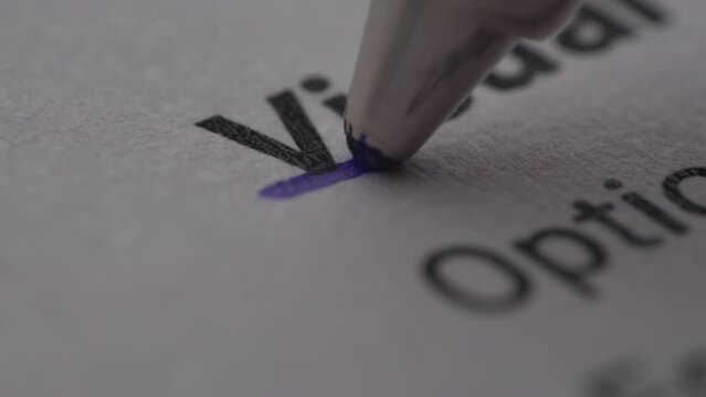 Underlining 'Visual' with a Pen on Paper. Extremely Close-up, shallow dof.