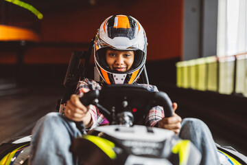 Go-Kart Racers Drive african woman driving with helmet