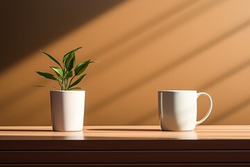 a plant in a pot next to a mug
