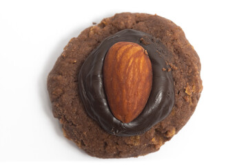Afghan cookies made from chocolate and cornflakes with almond on top view isolated on white...