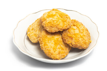 Cornflakes cookies in a small white plate isolated on white background clipping path