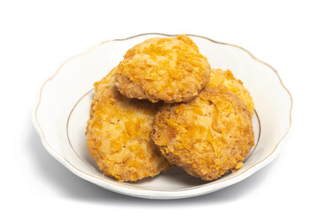 Cornflakes cookies in a small white plate isolated on white background clipping path