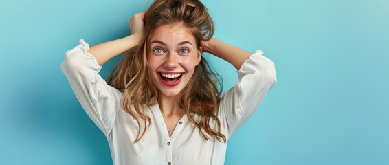 Joyful Young Woman with Hands in Hair, White Blouse, Blue Background, banner - obrazy, fototapety, plakaty