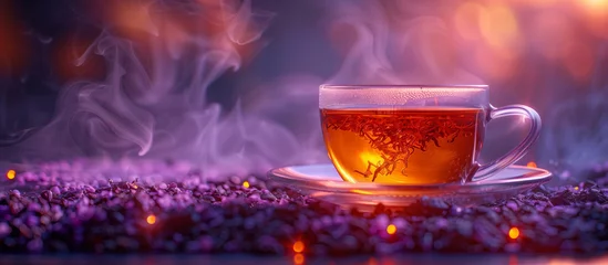 Rolgordijnen Hot tea glass cups on a background of purple flowers © Alina Zavhorodnii