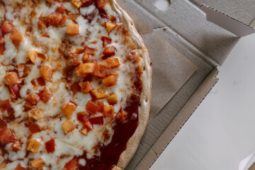 Kyiv, Ukraine. On March 2, 2024, a freshly made pizza delivered for breakfast from a pizzeria lies...
