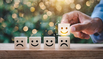 Close up customer hand choose smiley face and blurred sad face icon on wood cube, Service rating,...